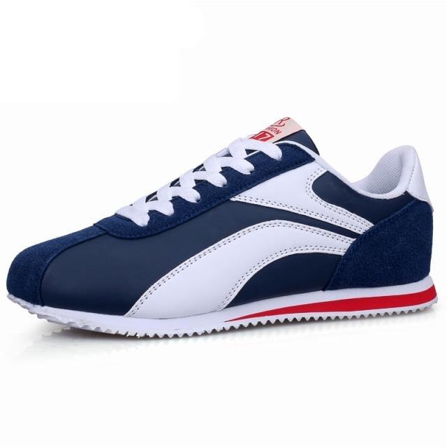 Stevvex athletic running sneakers in navy blue and white with red accent on Tampa Home & Garden Store