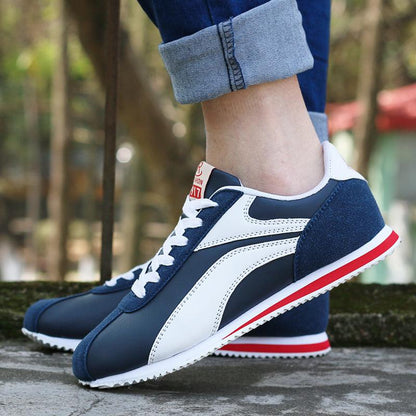 Stevvex men's blue-white athletic sneakers with navy suede heel and red stripe sole on Tampa Home & Garden Store