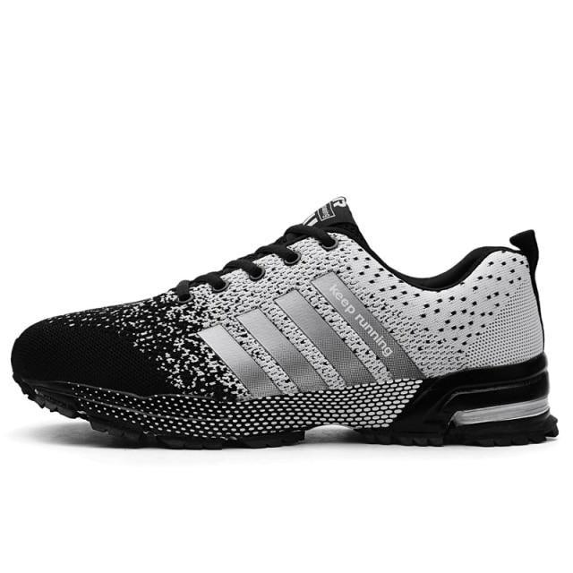 Stevvex athletic sneakers with black toe and white knit upper, silver side stripes on Tampa Home & Garden Store