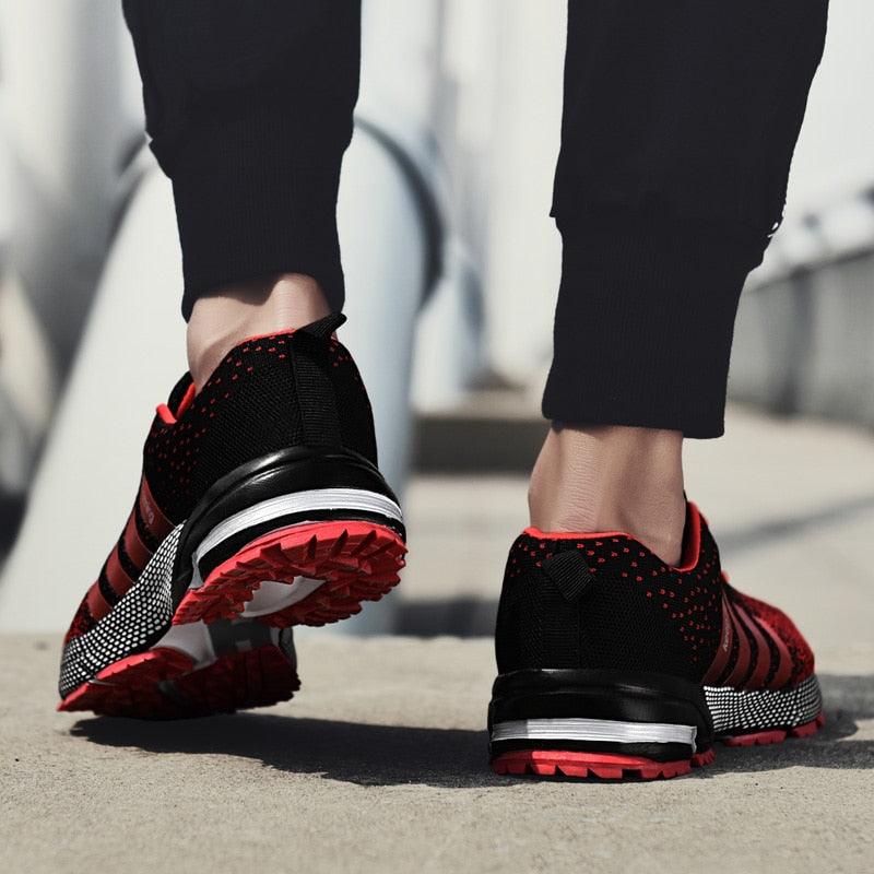 Stevvex athletic sneakers pair in black and red with knit upper and cushioned sole on Tampa Home & Garden Store