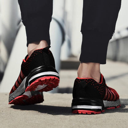 Stevvex athletic sneakers pair in black and red with knit upper and cushioned sole on Tampa Home & Garden Store