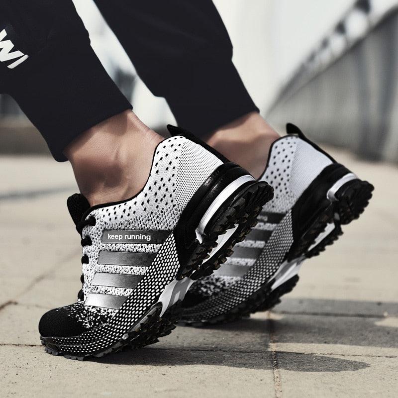 Stevvex breathable athletic running sneakers white black knit with keep running label on Tampa Home & Garden Store