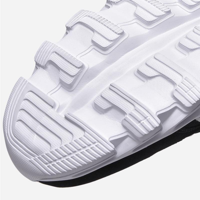 White running shoe outsole with chunky tread blocks lightweight breathable athletic footwear on Tampa Home & Garden Store