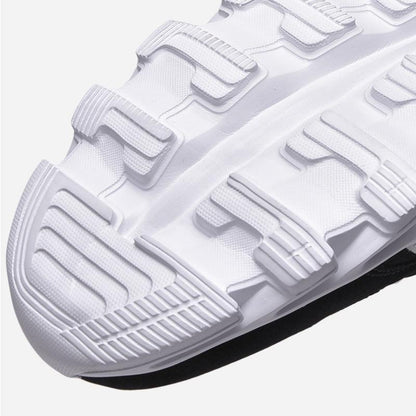 White running shoe outsole with chunky tread blocks lightweight breathable athletic footwear on Tampa Home & Garden Store