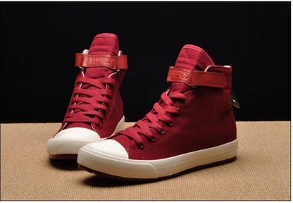 Stevvex red high-top canvas sneakers with white toe cap, rubber sole, lace-up and Velcro strap on Tampa Home & Garden Store
