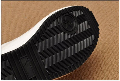 Stevvex men's white canvas sneakers outsole view with black rugged tread non-slip sole on Tampa Home & Garden Store
