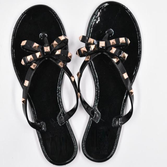 Stevvex black bowknot thong sandals pair for women, flat beach flip flops with bow details on Tampa Home & Garden Store