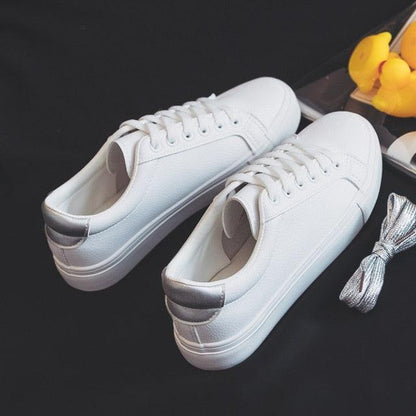 Stevvex white leather women’s sneakers, low-top lace-up casual shoes with silver heel tab on Tampa Home & Garden Store