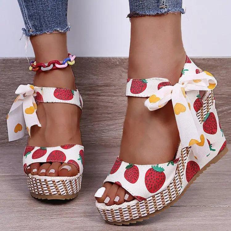 Stevvex strawberry-print sandals pair with white fabric, bow ankle ties, woven jute platform on Tampa Home & Garden Store