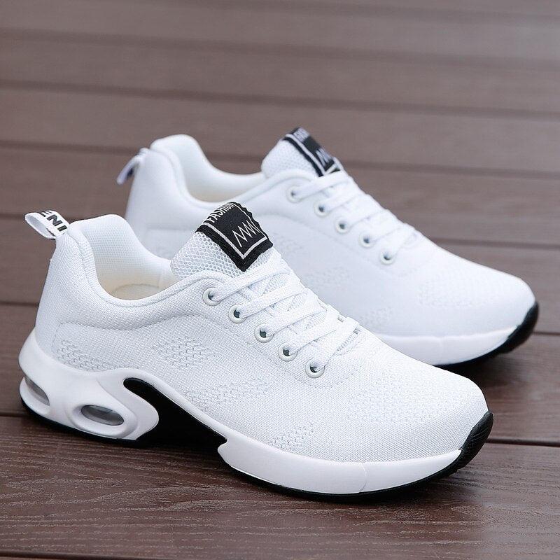 Stevvex white athletic sneakers pair with mesh upper and cushioned sole on Tampa Home & Garden Store