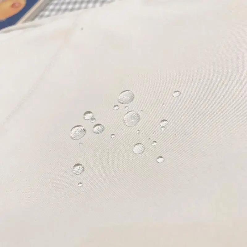 Backpack fabric close-up in white solid color with water droplets on surface on Tampa Home & Garden Store