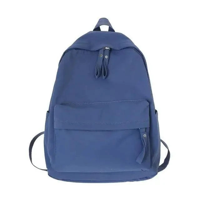 Stevvex blue solid-color laptop backpack with front pocket and top carry handle on Tampa Home & Garden Store