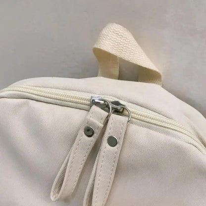 Laptop backpack Stevvex white canvas with dual zipper pulls and top grab handle on Tampa Home & Garden Store