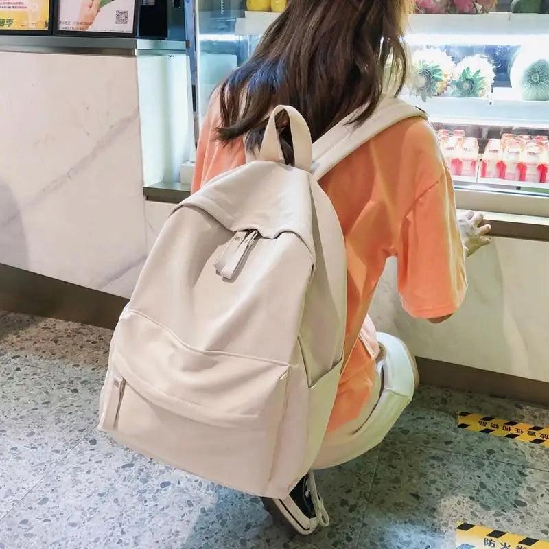 Stevvex anti theft laptop backpack ALU30152HBA for teens, beige solid color with top handle and front zip pocket on Tampa Home & Garden Store