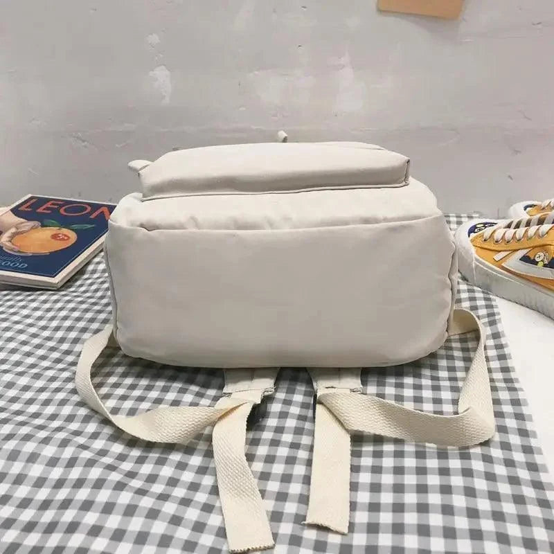 Beige anti-theft laptop backpack for teens with adjustable straps, solid color fabric on Tampa Home & Garden Store