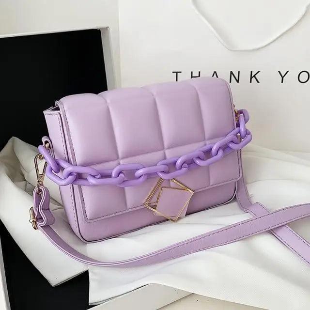 Fashionable women's Stevvex lavender shoulder bag with chunky purple chain strap and gold clasp on Tampa Home & Garden Store