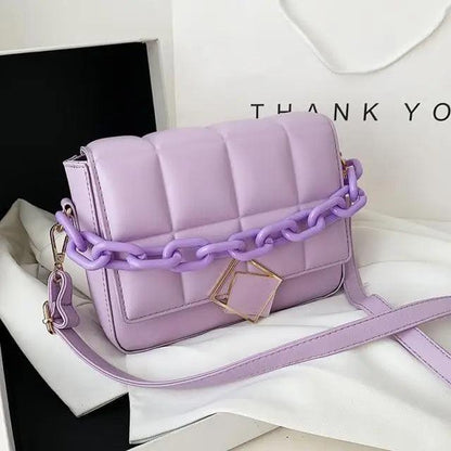 Fashionable women's Stevvex lavender shoulder bag with chunky purple chain strap and gold clasp on Tampa Home & Garden Store