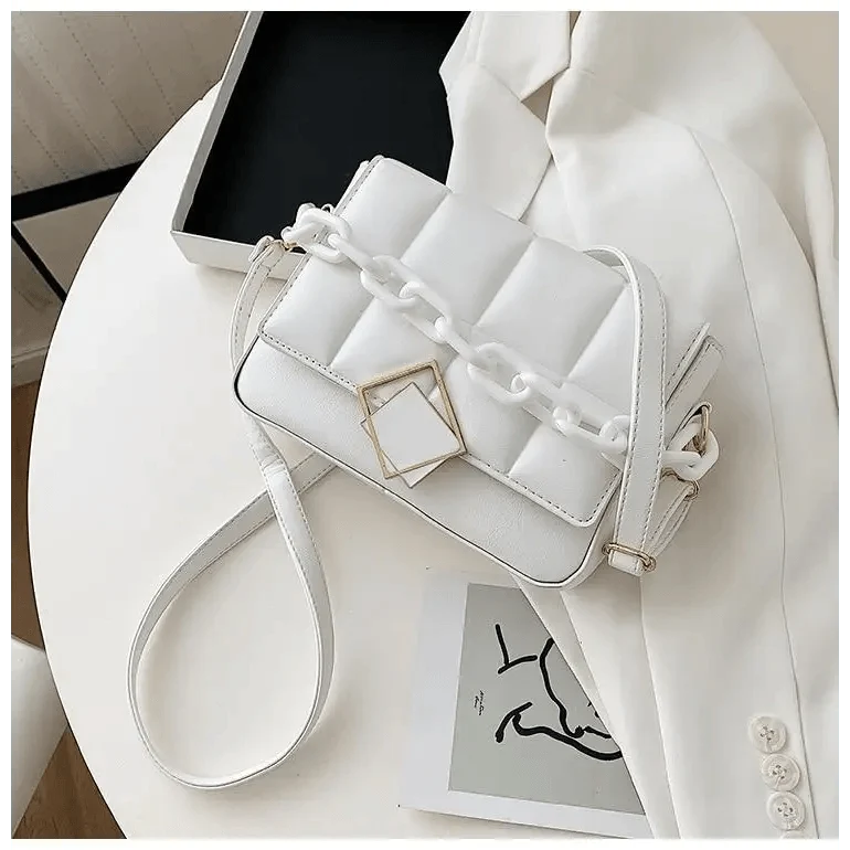 White quilted single-shoulder bag with chunky chain strap and gold square buckle on Tampa Home & Garden Store