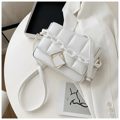 White quilted single-shoulder bag with chunky chain strap and gold square buckle on Tampa Home & Garden Store