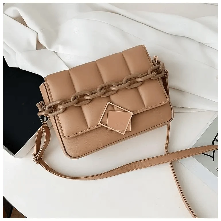Tan quilted shoulder bag with chunky chain and square geometric clasp, crossbody style on Tampa Home & Garden Store