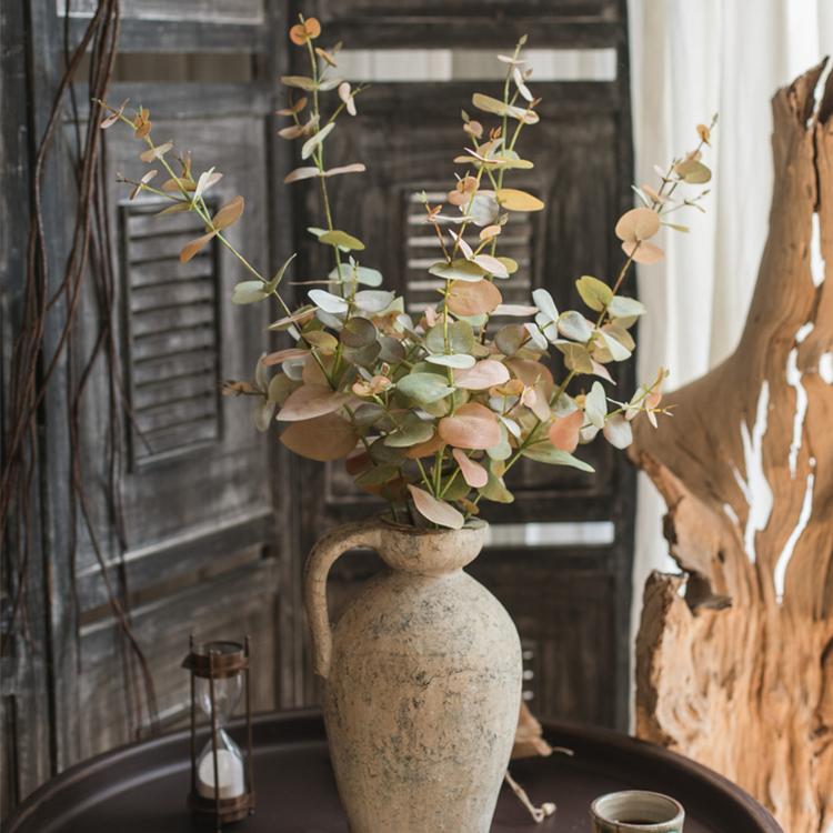 Faux Leaf Autumn Eucalyptus Artificial Stem in ceramic vase with green and brown hues on Tampa Home & Garden Store