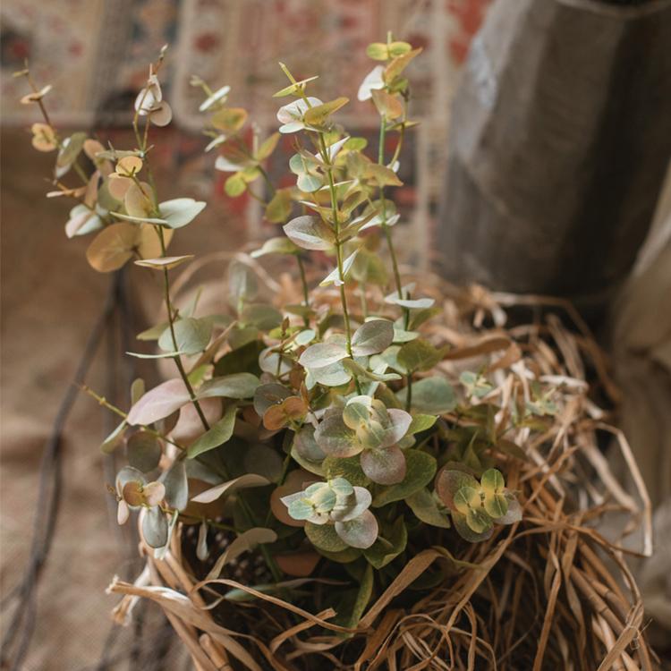 Faux Leaf Autumn Eucalyptus Stem RusticReach with green leaves in a wicker basket on Tampa Home & Garden Store