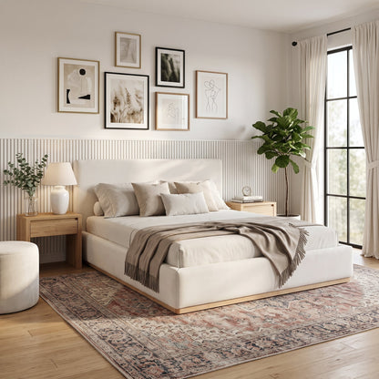 Elegant upholstered queen bed with solid wood frame in beige fabric, gallery wall art on Tampa Home & Garden Store