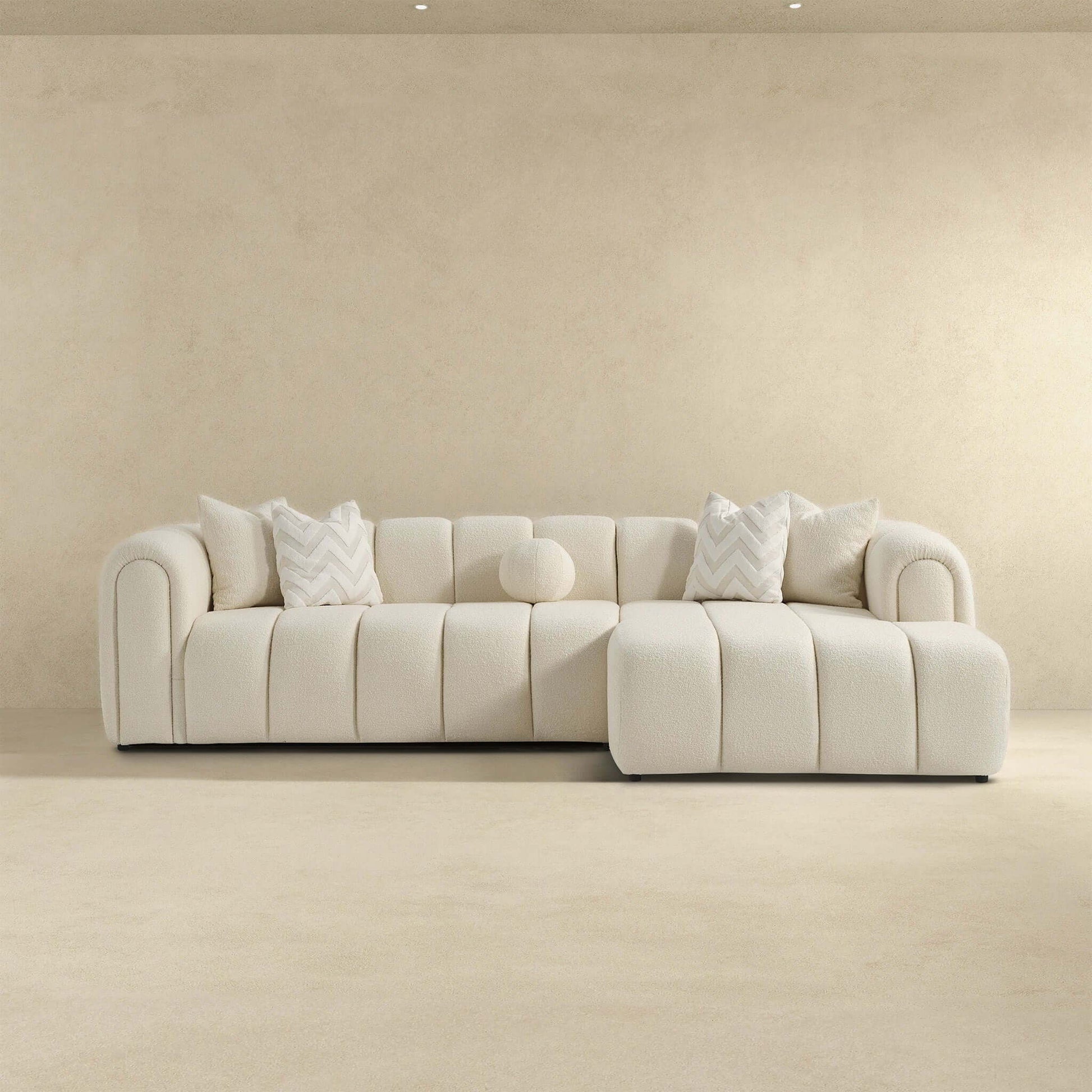 Beatrice ivory modern tufted right sectional sofa by HouseOfZazla with chevron pillows on Tampa Home & Garden Store