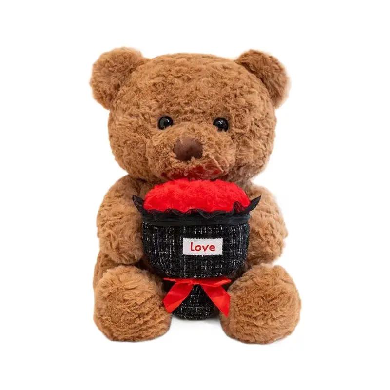 Brown plush teddy bear with black bucket holding a plush heart and red ribbon bow on Tampa Home & Garden Store