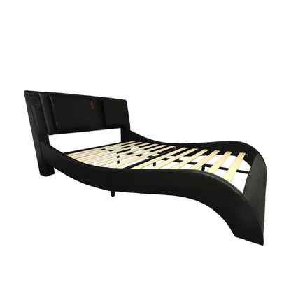 Black upholstered platform bed frame with curved headboard and wooden slatted base on Tampa Home & Garden Store