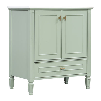 Freestanding vanity in soft green with white countertop, doors and drawer, gold hardware on Tampa Home & Garden Store