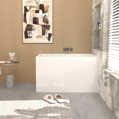 Modern glossy white freestanding acrylic bathtub in a wood-paneled bathroom on Tampa Home & Garden Store