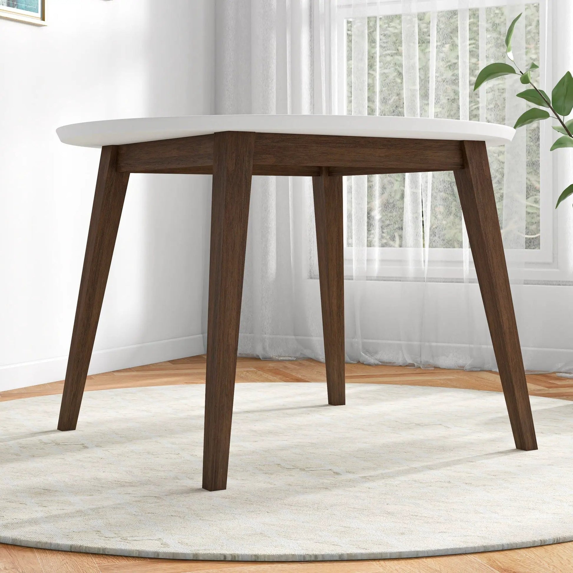 Paloma dining table with white round top and dark wood legs by Unique Piece Furniture on Tampa Home & Garden Store