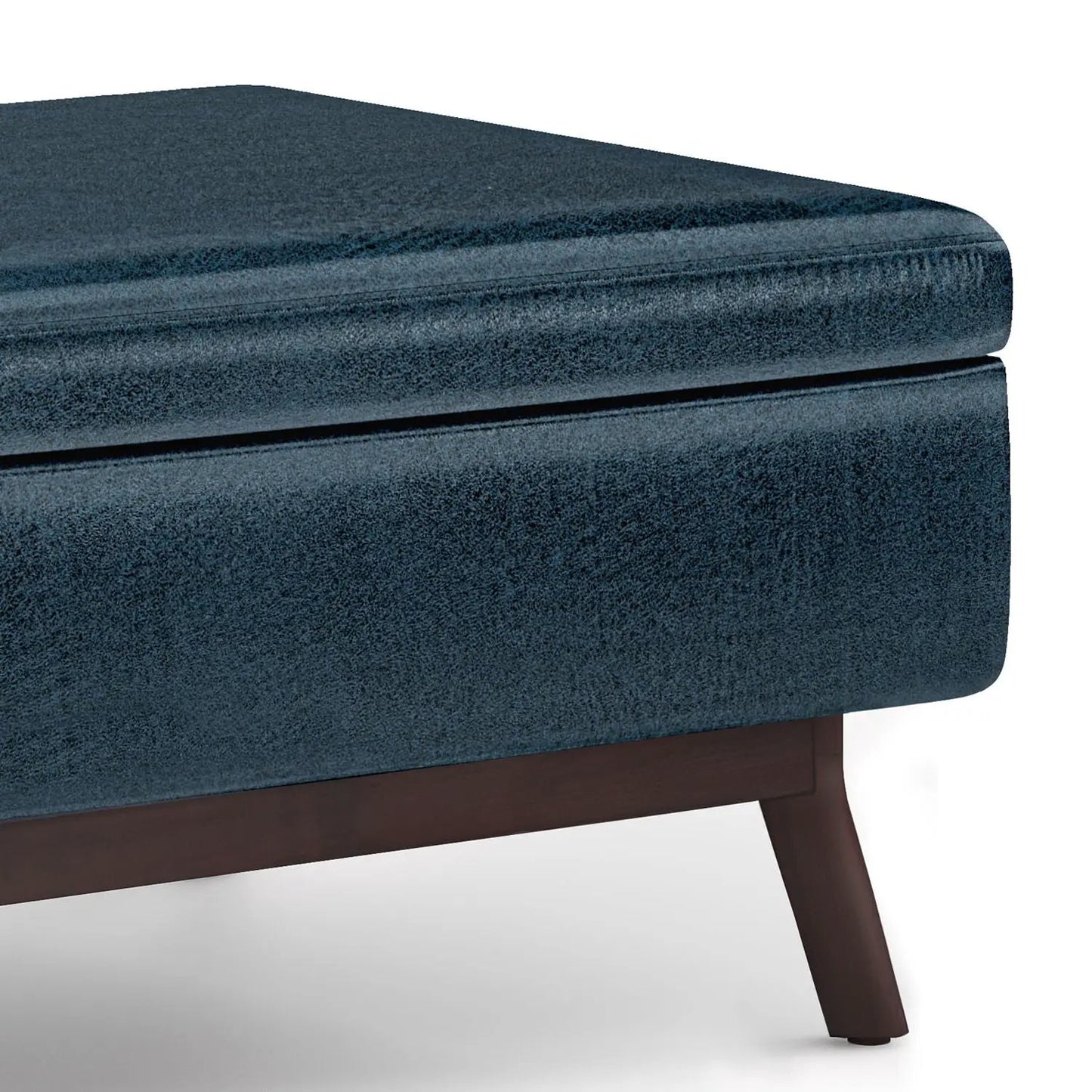 Owen upholstered rectangular storage ottoman in blue velvet fabric with dark wood legs on Tampa Home & Garden Store