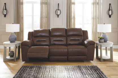 Stoneland reclining leather sofa in brown with tufted cushions and modern end tables on Tampa Home & Garden Store