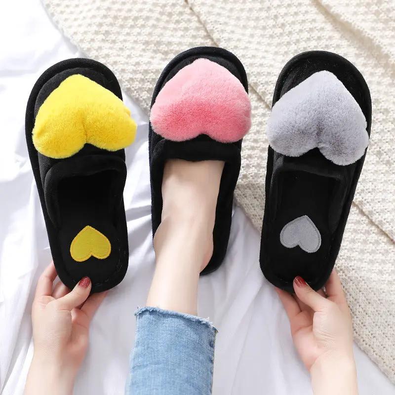 Set of 3 black fluffy home slippers with heart plush tops in yellow, pink, and gray for Valentine's Day on Tampa Home & Garden Store
