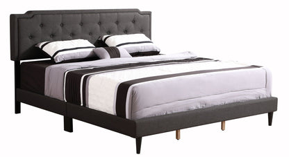 Button tufted bed in dark gray upholstered fabric with buttoned headboard and striped bedding on Tampa Home & Garden Store