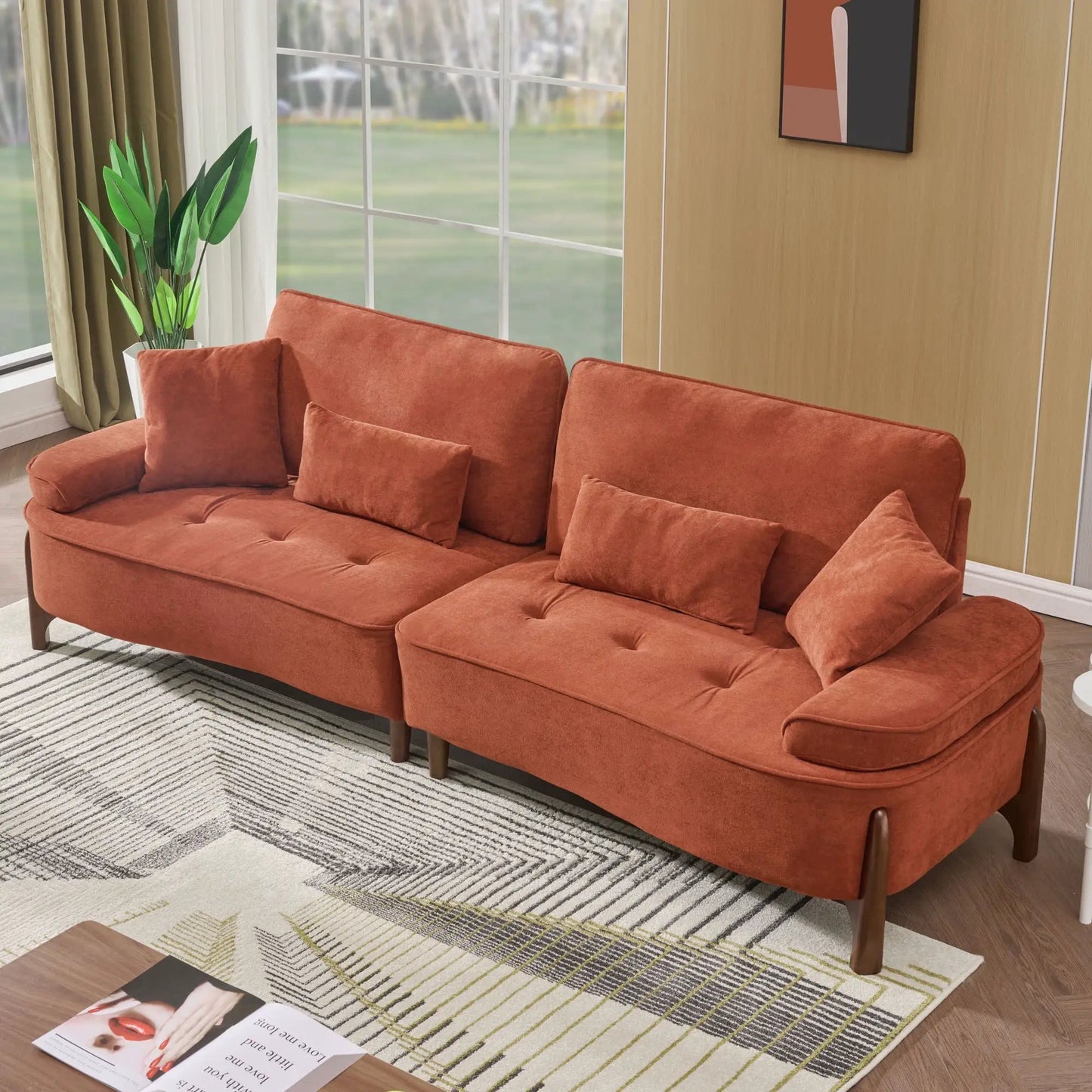 Comfortable deep-seated burnt orange stationary sofa with pillows in a bright living room on Tampa Home & Garden Store
