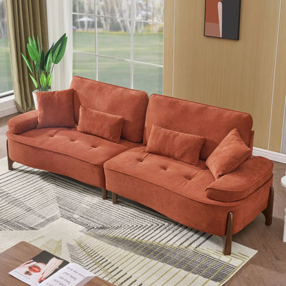 Comfortable deep-seated burnt orange stationary sofa with pillows in a bright living room on Tampa Home & Garden Store
