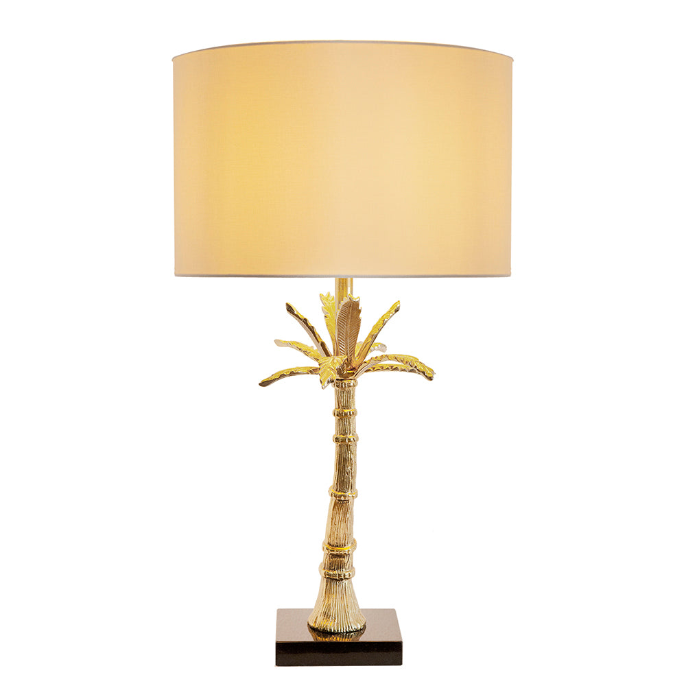 Gold leaf palm table lamp with beige drum shade and dark square base on Tampa Home & Garden Store
