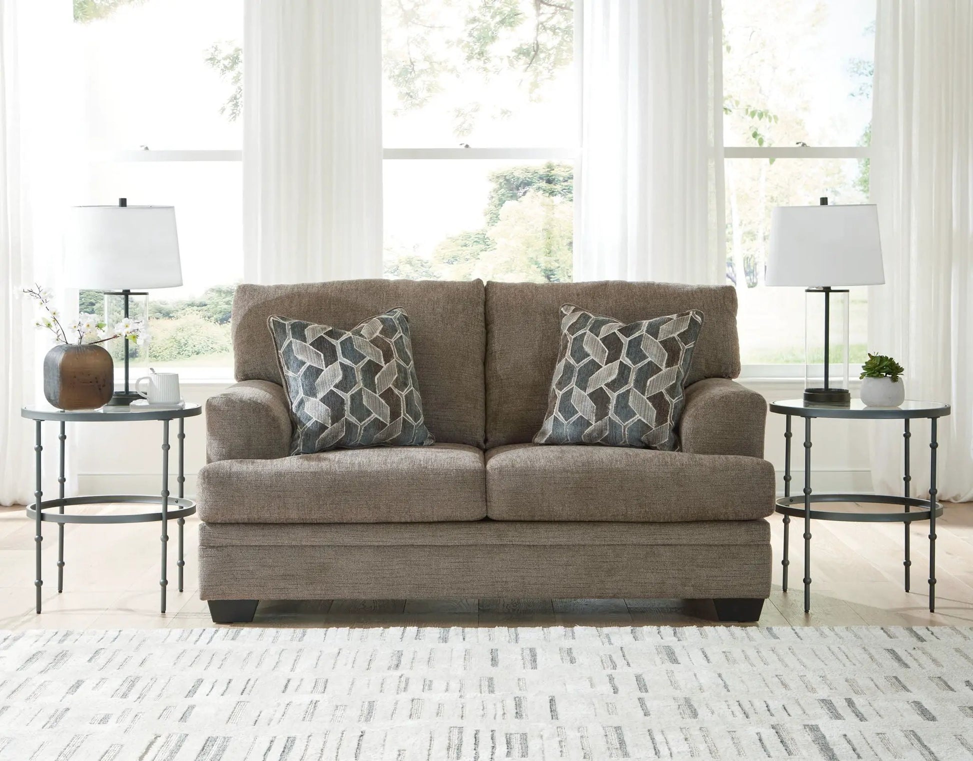 Stonemeade 3-piece living room set in taupe fabric with sofa, tables, lamps, cushions on Tampa Home & Garden Store