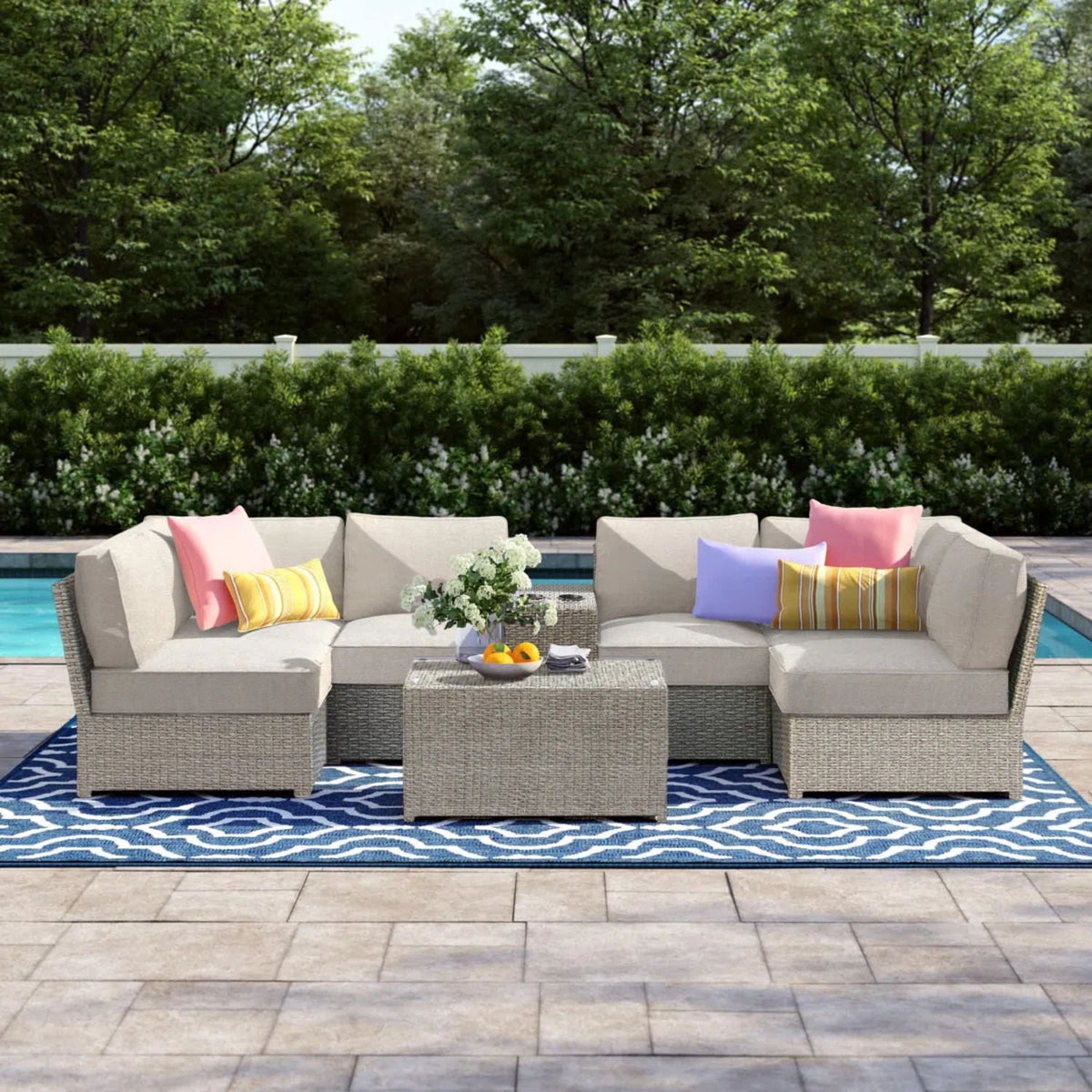 2-piece outdoor rattan sectional set with beige cushions and bright pillows HouseOfZazla on Tampa Home & Garden Store