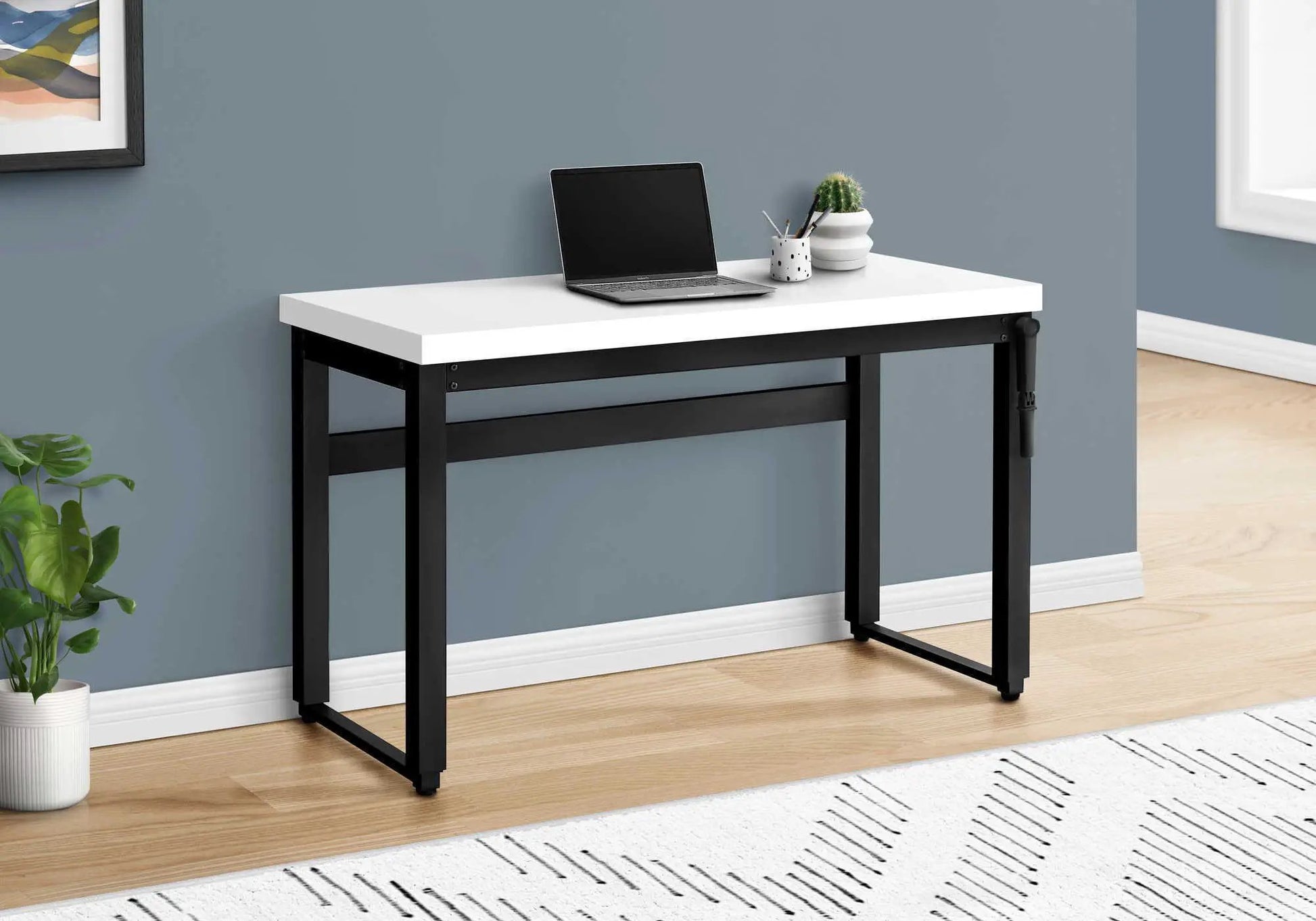 Computer Desk standing adjustable with white top and black frame; laptop setup on Tampa Home & Garden Store