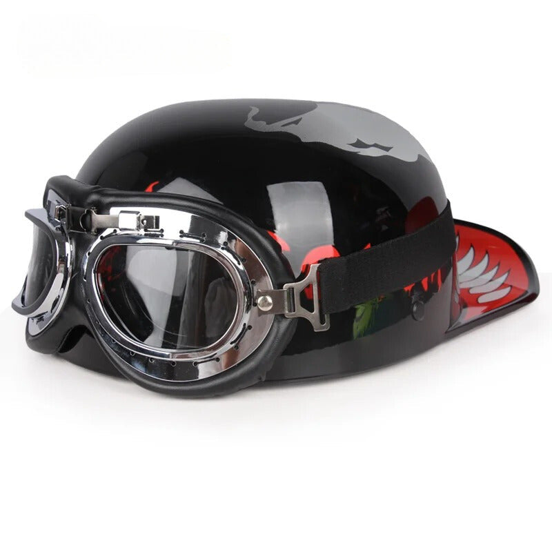 Vintage half motorcycle helmet with chrome goggles, black glossy shell and red side graphic on Tampa Home & Garden Store