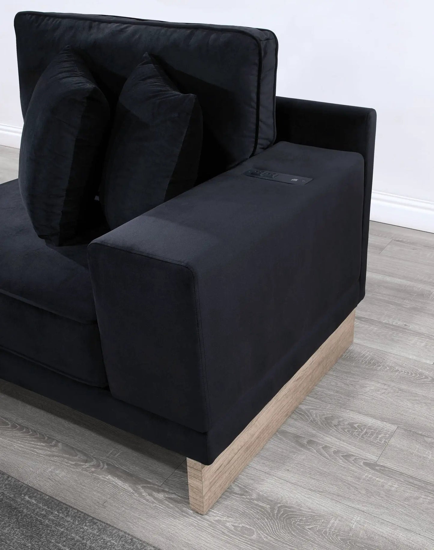 Memphis reversible sectional ottoman in black fabric with USB charging ports and wood base on Tampa Home & Garden Store