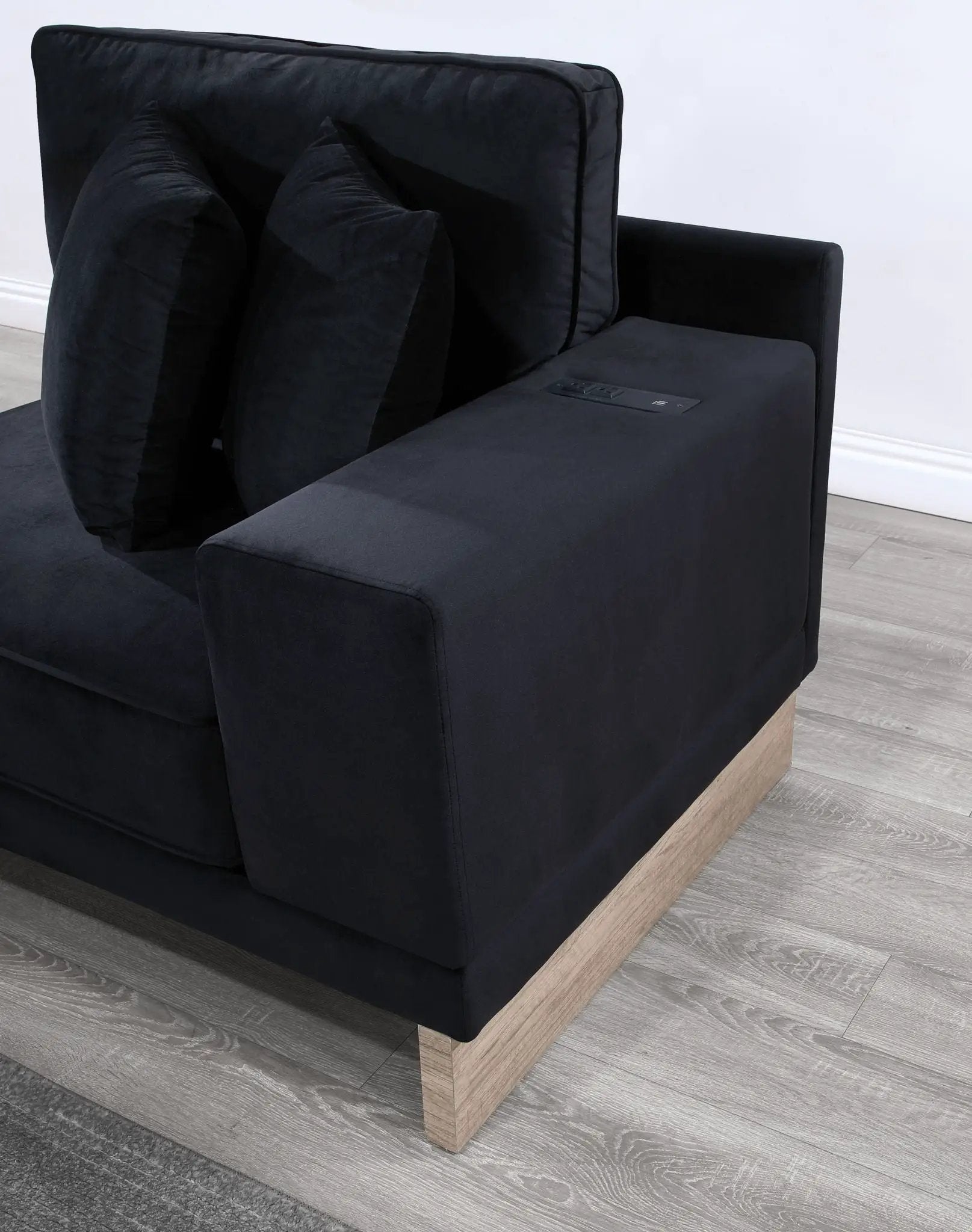 Memphis reversible sectional ottoman in black fabric with USB charging ports and wood base on Tampa Home & Garden Store