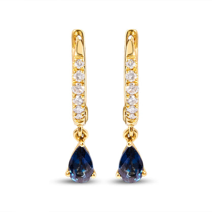 Pair of 10K yellow gold huggy hoop earrings with 1/10 Cttw diamonds and pear blue sapphire drops on Tampa Home & Garden Store