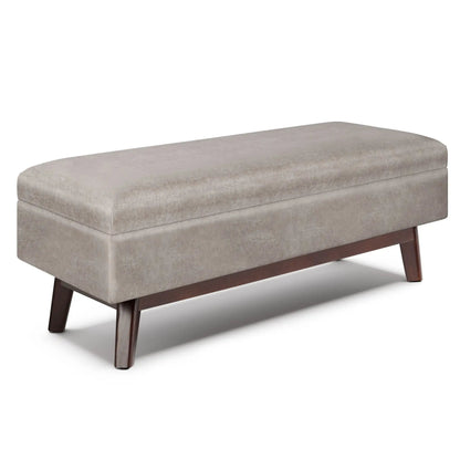 Owen Upholstered Rectangular Storage Ottoman by Unique Piece Furniture in taupe, with dark wood legs on Tampa Home & Garden Store