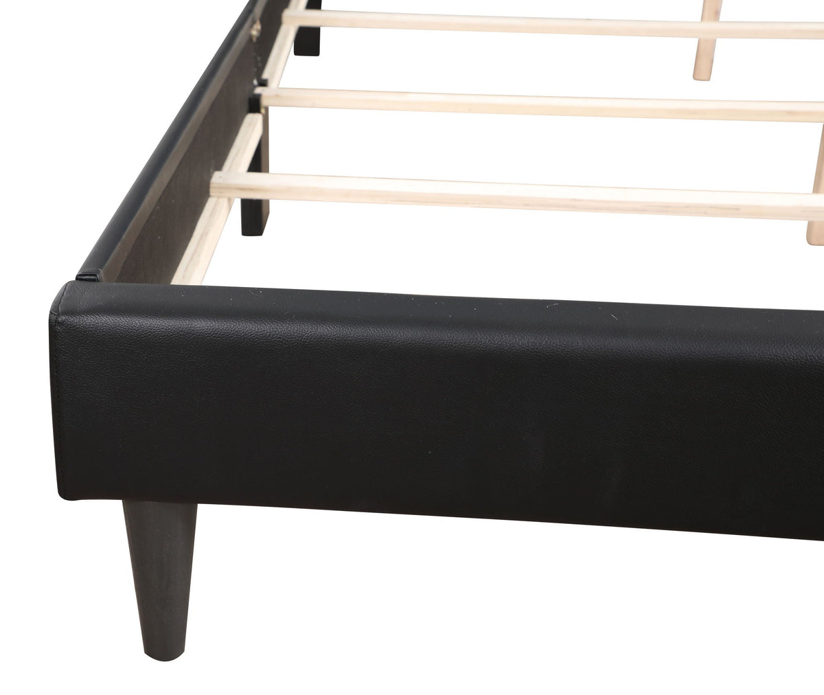 Button tufted bed frame in black upholstery with wooden slats and tapered legs on Tampa Home & Garden Store