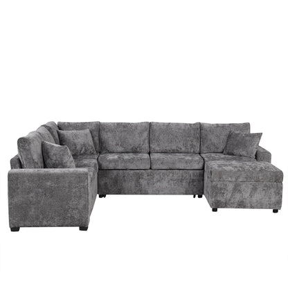 Gray textured sleeper sectional with storage ottoman and three decorative pillows on Tampa Home & Garden Store